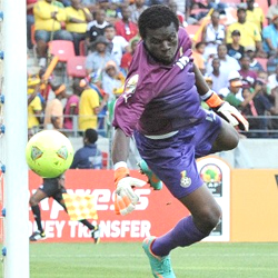 Ghana goalkeeper Fatau Dauda watches the ball hit the post Saturday. (Photo: Stephane De Sakutin/AFP/Getty Images)