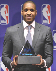 The Nuggets' Masai Ujiri receives the award for 2012-13 NBA executive of the year Thursday at the Pepsi Center. (Hyoung Chang, The Denver Post)