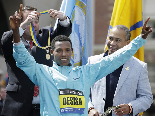 Boston Marathon winner returns his medal to city