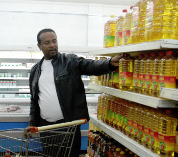 Efrem Ketema was picking items from Bambis Supermarket in one of his regular weekly visits. He would later pay 871 Br for items like flour, meat, vegetables, tuna, pasta, and vegetables.(Photo: AddisFortune.com)