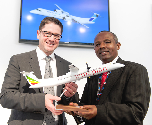 Ãƒâ€°ric Martel, President, Bombardier Customer Services and Specialized & Amphibious Aircraft (left) and Mr. Mesfin Tasew, Chief Operating Officer, Ethiopian Airlines, celebrate the airline being added to BombardierÃ¢â‚¬â„¢s Authorized Service Facility Network. (Photo: bombardier.com)