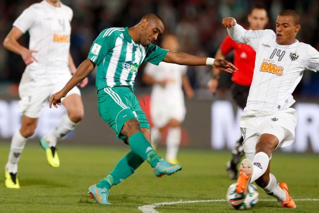 Raja Casablanca's Mouhssine Iajour scores his side's opening goal during the semi final soccer match between Raja Casablanca and Atletico Mineiro at the Club World Cup soccer tournament in Marrakech, Morocco, Wednesday, Dec. 18, 2013. Photo: Matthias Schrader, AP