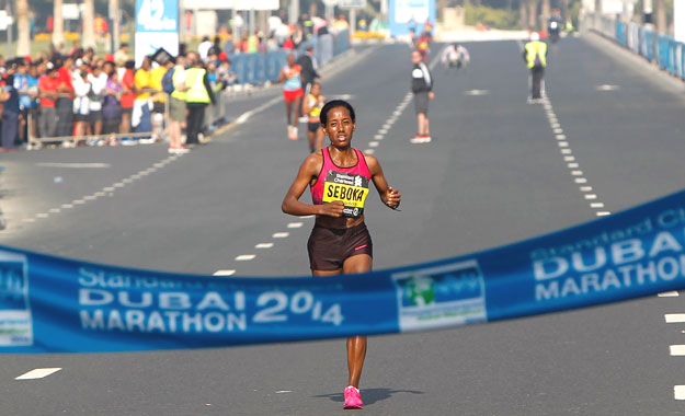 Mula Seboka Seyfu of Ethiopia, touching the finishing line during the Standard Chartered Dubai Marathon at Umm Suqeim Road in Dubai on January 24. KT photo by Juidin Bernarrd