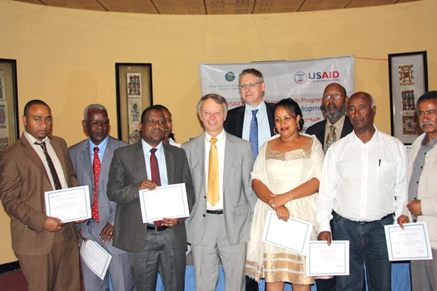 New grantees pose with USAID Ethiopia Mission Director Dennis Weller (center front) and CNFA Chief of Party Marc Steen (center rear). Photo: Robert Sauers, USAID Ethiopia.