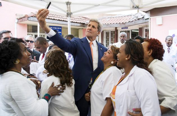 U.S. Secretary of State John Kerry takes a "selfie" with nurses and workers during a visit to the Gandhi Memorial Hospital in Addis Ababa May 1, (photo: ca.finance.yahoo.com) - 