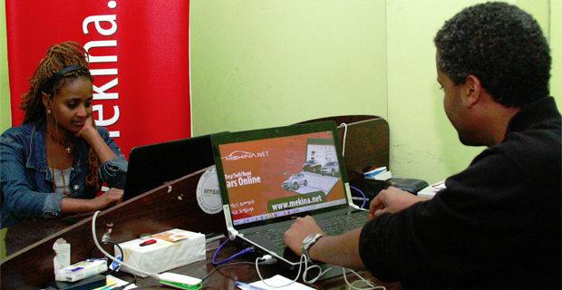 Araya Lakew of Mekina.net and co-worker handling daily operations in Getu Building head office. (photo: Addis Fortune)