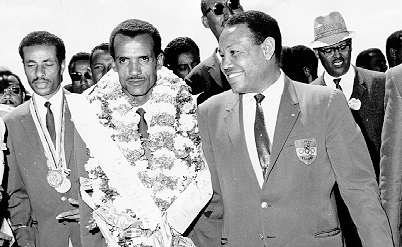 Yidnekachew with Olympic legends Abebe Bikila (left) and Mamo Wolde (center) in 1968.