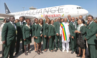  GabreMariam (in national attire) lines up with crew members to celebrate a Star Alliance innovation