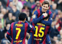 On top of the world: Lionel Messi netted a hat-trick in Barcelona's 5-0 demolition of Levante in La Liga.
