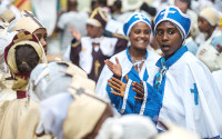 Faithful dressed with traditional clothes attend the Timkat celebration on January 18, 2015 in Addis Ababa. Photo: Alamy - 